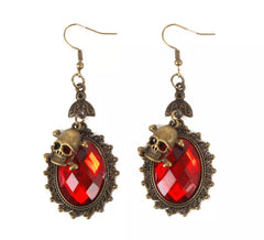 Boucles d'oreilles tête de mort avec faux rubis