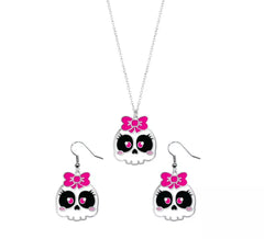 Boucles d'oreilles et collier tête de mort avec nœud